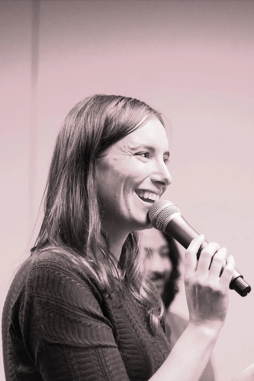 Claire Bourrasset, founder of ROUj, speaking into a microphone