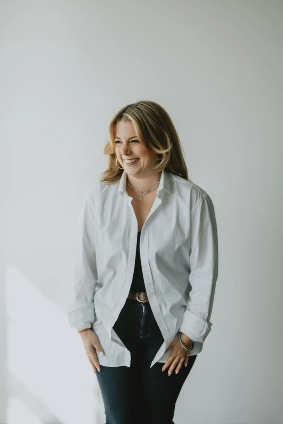 Clémence Tillerot standing, smiling, hands in her pockets